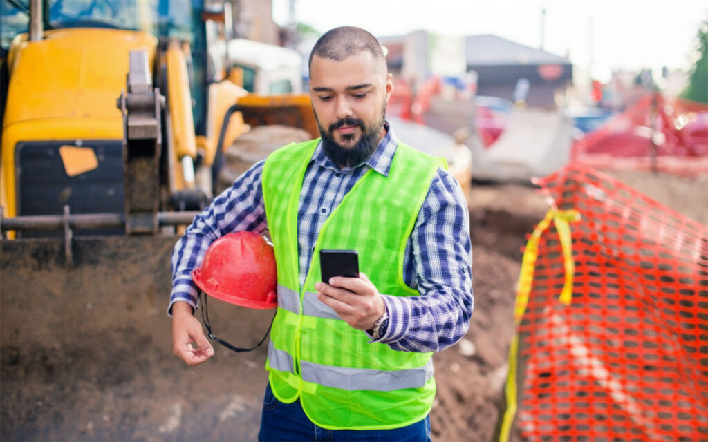 Construction worker checking member portal